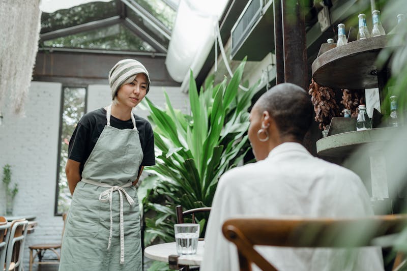 Wing Snob team member serving customers